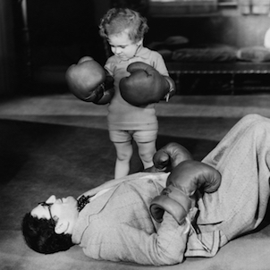 retro image of a boy in boxing gloves