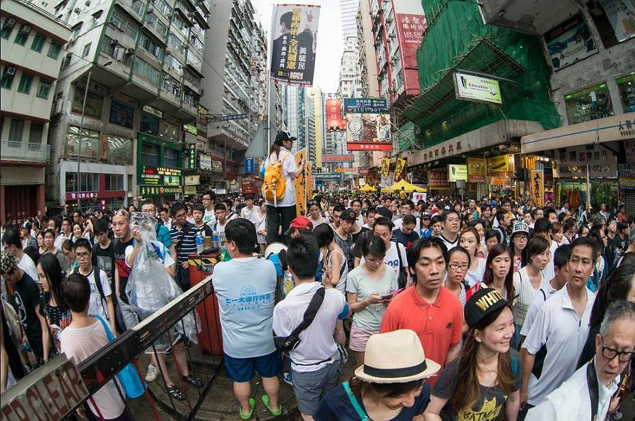 Crowd in Hong Kong, July 1, 2014 (Photo by doctorho) Creative Commons license via Flickr