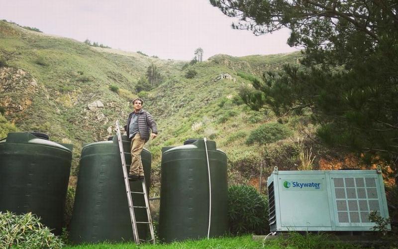 David Hertz harvesting water in Big Sur, California. Skywater 150 produces up to 150 gallons a day. The water can be stored in collection tanks for future use. 2018 (Photo courtesy Skysource/Skywater Alliance)