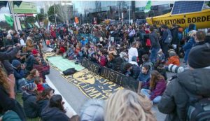 As the negotiations continue behind closed doors inside the COP25 venue, members of the nonprofit climate action groups Extinction Rebellion and FridaysForFuture blocked the roads leading to the venue, staging a large protest, calling the meeting "another lost opportunity." December 11, 2019 (Photo courtesy Earth Negotiations Bulletin)