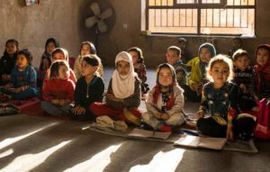 Children of trainee carpet weavers at an in-house kindergarten at the Afghan Bazar Carpet Company in Mazar-e Sharif, in northern Afghanistan's Balkh Province. December 3, 2019 (Photo courtesy International Labour Organisation Asia-Pacific) Creative Commons license via Flickr