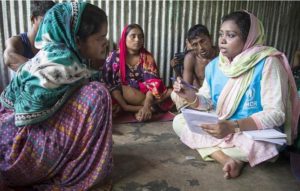 Caption: Rohingya refugee Rashida Begum, 23, left, receives counseling at Kutupalong refugee camp in Bangladesh. 2019 (Photo by Roger Arnold courtesy UNHCR)