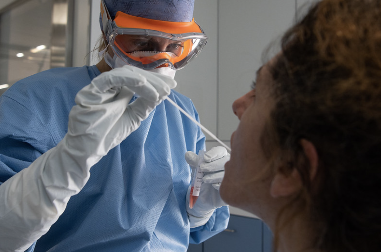 Medic tests a patient for COVID-19, the disease caused by the novel coronavirus, at the Hospital Clinic, Barcelona, Spain, March 18, 2020 (Photo by Hospital Clinic) Creative Commons license via Flickr