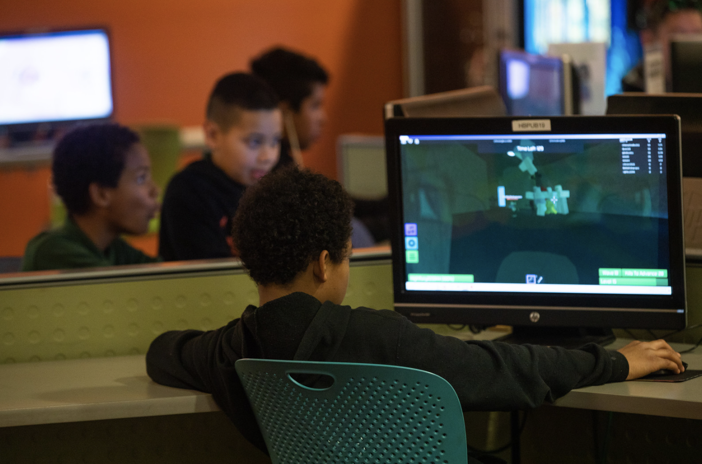 Boys take eagerly to the computers at the San José Public Library, San José, California, December 21, 2018. (Photo by Edward Duncan courtesy San José Public Library) Creative Commons license via Flickr