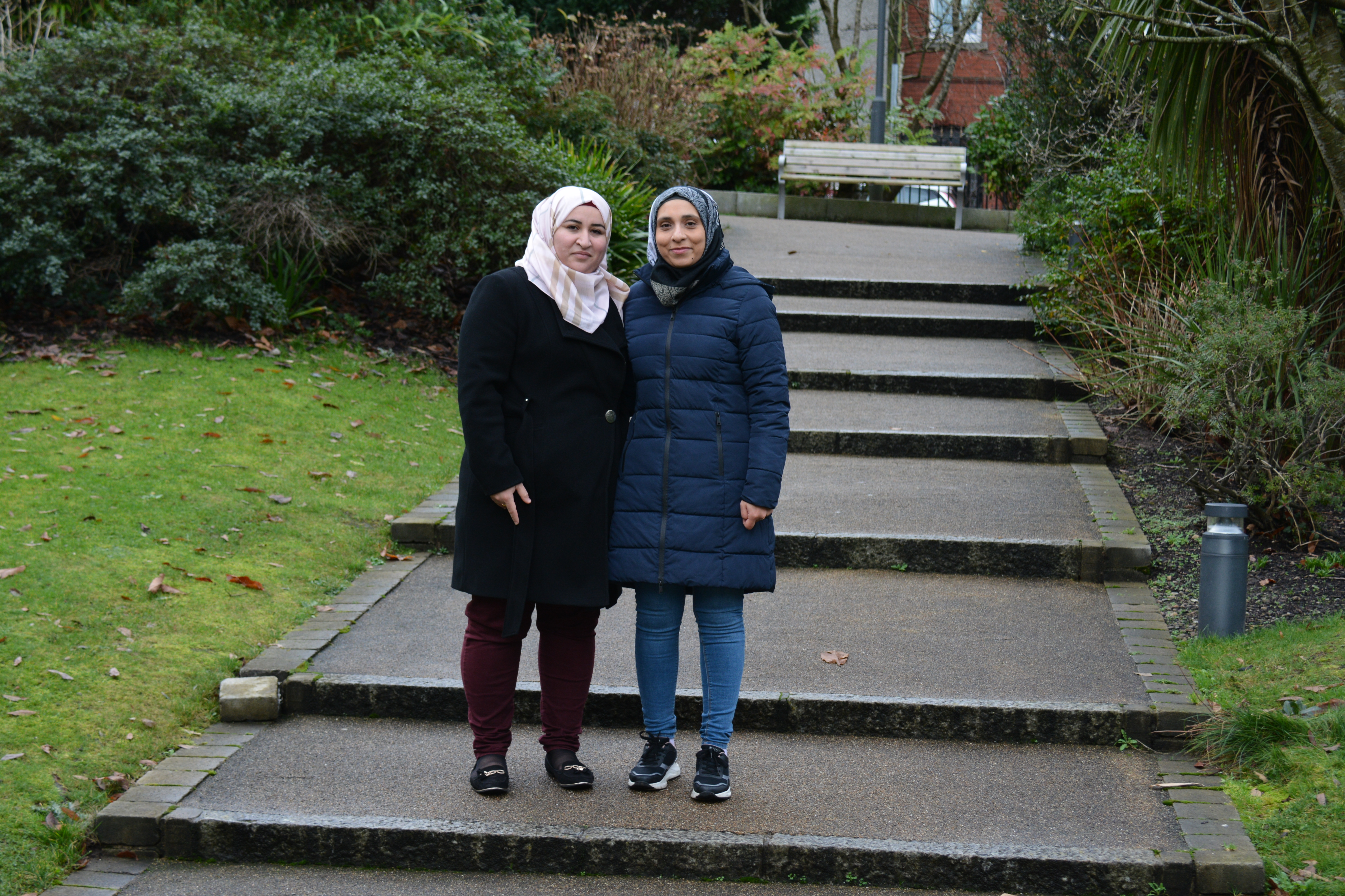 Aisha, left, and her daughter Sundos, both resettled from Syria in Northern Ireland, at Warrenpoint Municipal Park, County Down, Northern Ireland, December 2020 (Photo by Brian McAlinden) 