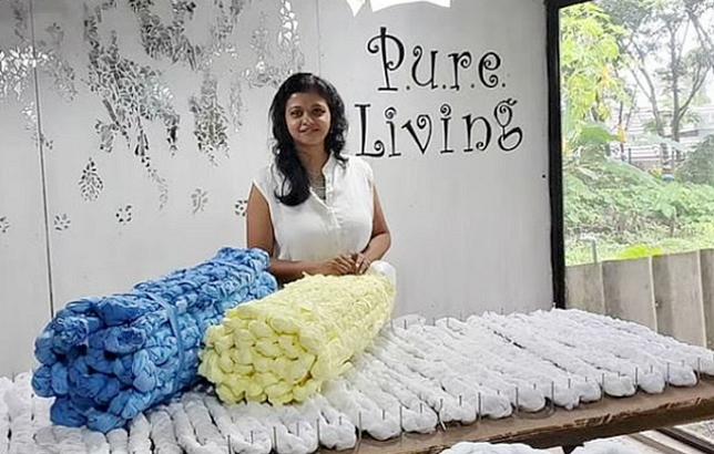 Caption: Fashion designer Laksmi Menon, founder of Pure Living, with the bedrolls she designed using plastic waste from the manufacture of personal protective equipment. 2020 (Photo courtesy Laksmi Menon via Facebook) Posted for media use