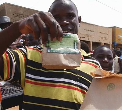  In Rwanda markets, purchases are packed in paper bags. 2013 (Photo by Harvest Plus) Crative Commons license via Flickr