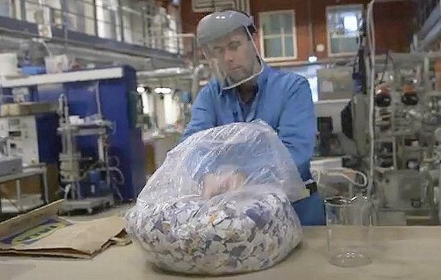 In his lab Edvin Ruuth, researcher in chemical engineering at Lund University, prepares to transform scraps of cotton into a sugar solution before turning that solution into a new textile, February 2021 (Screengrab from video courtesy Lund University) Posted for media use
