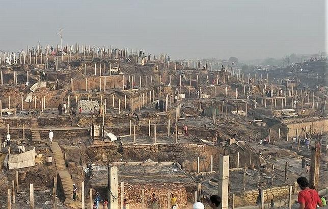 Rohinga refugees from Myanmar watch as a giant blaze destroys thousands of shelters at the world's largest refugee camp in Cox's Bazaar. March 21, 2021 (Photo courtesy UNHCR) Posted for media use 