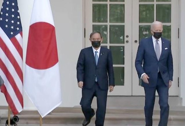  President Joe Biden, right, hosts Japanese Prime Minister Yoshihide Suga at the White House, his first in-person visit with a foreign leader since on January 20, 2021 when he assumed the presidency. The two leaders agreed to cooperate to solve the climate crisis. April 16, 2021, Washington, DC (Photo courtesy Voice of America) Posted for media use  