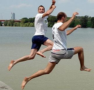 Men participate in The Big Jump 2021 by enjoying a river in the Jezera Eco-Center near Bijeljina, a city in Bosnia and Herzegovina.