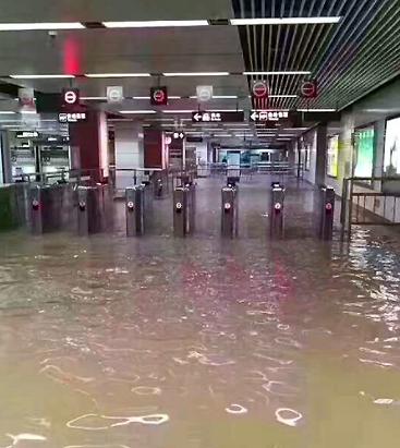 Heavy rain floods Chegongmiao Metro Station in the city of Shenzhen, China, June 13, 2017 (Photo by Chris) Creative Commons license via Flickr