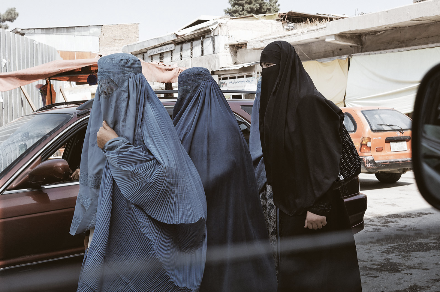 Afghan women wearing burkas on a street in the capital Kabul, January 19, 2014 (Photo by lynnstarbucks) Creative Commons license via Flickr