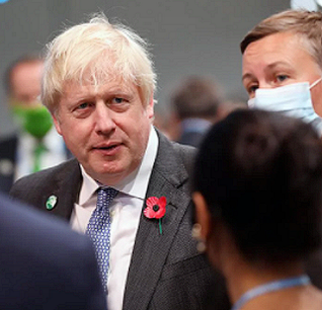 UK Prime Minister Boris Johnson with delegates at COP26, November 2, 2021 (Photo courtesy Earth Negotiations Bulletin) Used with permission