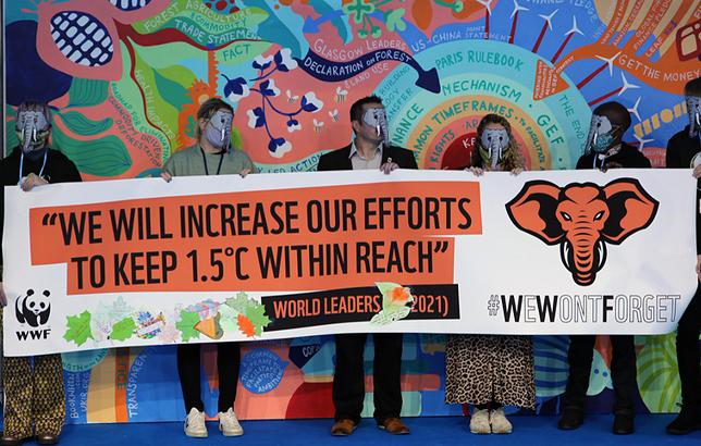 WWF supporters displayed a colorful banner at the World Leaders Summit part of COP26, November 12, 2021, Glasgow, Scotland (Photo by Earth Negotiations Bulletin) Used with permission