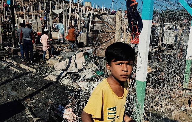 Barbed wire fencing between camps at Cox's Bazar, Bangladesh made it harder for refugees to escape the fires. January 2022 (Photo by Imrul Islam, Norwegian Refugee Council) Posted for media use