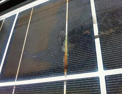 Cracked, peeling backsheet on solar panels leads to water infiltration and ribbon corrosion that impairs power output. December 2018 (Photo by Andy Walker, U.S. National Renewable Energy Lab, NREL) Public domain